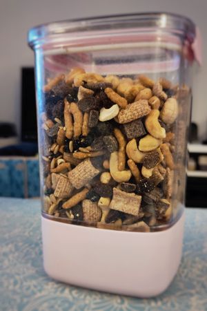 a nine-cup air-tight storage container, filled to the top with trail mix