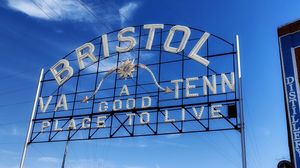 a large sign spanning over State Street at the VA/TN line that reads: Bristol, a good place to live. The left side of the side points to Virginia, the right to Tennessee.